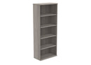 Wooden bookcase in Alaskan Grey Oak finish by TC, featuring a sleek modern design with multiple shelves for storage.