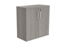 Front view of TC Core wooden cupboard in Alaskan grey oak finish, showcasing its sleek design and natural wood grain.