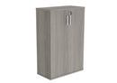 Front view of the Core Wooden Cupboard in Alaskan Grey Oak by TC, showcasing its sleek wooden design and modern storage compartments.