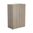 Front view of TC Essentials Grey Oak wooden cupboard with sleek design and storage compartments.