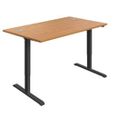 Black economy single motor sit-stand desk with 1200mm width and Nova Oak surface, featuring a sleek, modern design.