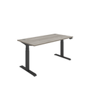 Front view of TC Core Dual Motor Sit-Stand Desk in Alaskan Grey Oak with black frame, showcasing adjustable height and modern design.