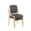 Stacked TC Renoir chairs with wooden frames and plush upholstered seats arranged for display.