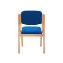 TC Renoir Chair with plush fabric upholstery and wooden legs, shown from the back view.