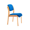 Side view of the TC Renoir Chair with red upholstery and wooden legs, showcasing its modern design and comfortable seating.