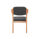 TC Renoir armchair with back view, showcasing its stylish design and arm support in a modern living room setting.