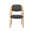 TC Renoir armchair with wooden legs and cushioned seat, showcasing a stylish, modern design with armrests for comfort.