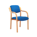 TC Renoir armchair with stylish fabric upholstery and wooden legs, shown from the front.
