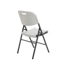 White Morph folding chair by TC, showing back view with sleek design and sturdy frame for versatile seating.