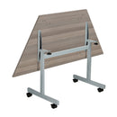 Gray oak One Eighty Trapezoidal Tilting Table by TC with adjustable angles and modern design for versatile workspace setup.