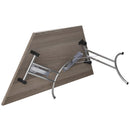 Grey oak folding trapezoidal table by TC, showcasing its sturdy design and compact, portable structure for versatile use.