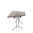Grey oak folding table with trapezoidal shape by TC, featuring a sturdy metal frame and smooth surface for versatile use.