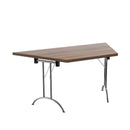 Walnut-colored TC One Union trapezoidal folding table with sturdy metal legs and compact design, suitable for versatile use.