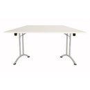 White TC One Union trapezoidal folding table set up on a flat surface, showcasing its shape and portable design.