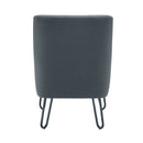 Pearl reception chair by TC with plush upholstery and elegant design, shown from the back in a stylish setting.
