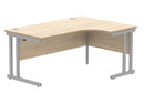 Front view of a TC Core Twin Upright Radial Desk in Canadian Oak finish, showcasing the wood grain and modern design.