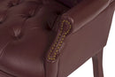 Teknik office guest chair in burgundy bonded leather with traditional button tufting and luxurious design.
