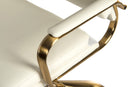 Teknik vintage executive office chair with white leather-look fabric, brass-colored metal frame, and five-star base.