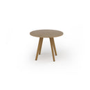 Unity circular dining table by Dams with solid oak legs and a smooth wooden surface, perfect for modern dining spaces.