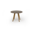 Dams Unity circular dining table with Nebraska oak finish and solid oak legs, modern wooden table for dining rooms.