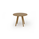 Unity circular dining table with solid oak legs by Dams, featuring a sleek wooden surface and modern design.