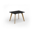 Dams Unity dining table with black finish and solid oak legs, showcasing a modern rectangular design and smooth tabletop surface.