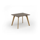 Dams Unity dining table with Nebraska oak top and solid oak legs, showcasing a sleek modern design and natural wood grain.