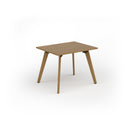 Dams Unity dining table with solid oak legs, featuring a wooden tabletop in a modern dining room setting.