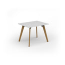 White Unity dining table by Dams with solid oak legs, featuring a sleek tabletop and sturdy wooden support.