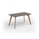 Dams Unity dining table with Nebraska oak top and solid oak legs, showcasing a sleek, modern design and natural wood finish.