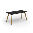 Black Unity dining table with solid oak legs by Dams, showcasing a sleek, modern design and sturdy wooden construction.