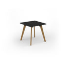 Black Unity dining table with solid oak legs by Dams, showcasing a sleek modern design and sturdy wooden construction.