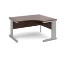 Dams Vivo ergonomic walnut desk with smooth surface and modern design, shown in a well-lit workspace setting.