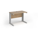 Dams Vivo 600mm deep straight desk in Kendal Oak finish, featuring a sleek, modern office workspace with clean lines and wood grain texture.