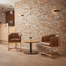 ZAP Nolan armchair in genuine pecan brown leather, shown indoors with plush cushions and wooden legs.