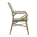 Pastel green Brittany armchair by ZAP with a plush fabric seat and wooden legs, shown from the side.