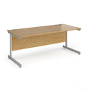 Dams Contract 25 800mm deep straight desk with oak finish and cantilever legs, showing a sleek, modern office workspace.