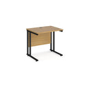 Dams Maestro 25 oak 600mm deep straight desk with cantilever legs, black finish, and modern office design.