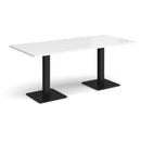 White Brescia rectangular dining table by Dams with flat square base, shown in a modern dining room setting.