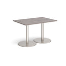 Dams Monza rectangular dining table with flat round base in grey oak finish, showcasing sleek modern design and wood grain texture.