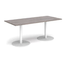 Dams Monza rectangular dining table with grey oak finish and flat round base, showcasing modern wooden design and smooth surface.