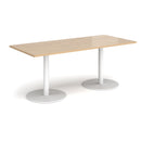 Dams Monza rectangular dining table with flat round base in Kendal Oak wood, showcasing sleek modern design and natural wood grain.