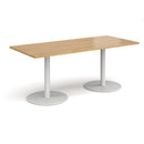 Dams Monza rectangular oak dining table with flat round base, showcasing a modern wooden tabletop and sturdy round support.