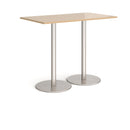 Dams Monza rectangular poseur table with flat round Kendal Oak base, featuring a sleek wooden tabletop and sturdy metal support.