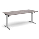 Grey oak rectangular folding leg table with straight foot rails by Dams, showcasing its sturdy design and foldable feature.