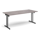 Grey oak rectangular folding leg table with straight foot rails by Dams, showcasing its sturdy design and foldable feature.
