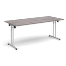 Grey oak rectangular folding leg table by Dams with straight foot rails, showcasing its sturdy design and foldable functionality.