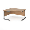 Dams Contract 25 ergonomic desk with cantilever leg in beech finish, featuring a graphite frame and spacious workspace.