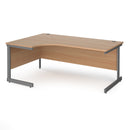 Dams Contract 25 ergonomic desk with cantilever leg in beech finish, shown from left side with graphite frame.