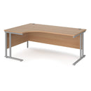 Dams Maestro 25 ergonomic desk with cantilever leg in beech wood finish and silver frame, shown from the left side.